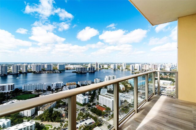 balcony featuring a water view