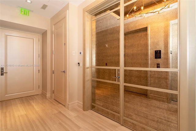 hall featuring hardwood / wood-style floors