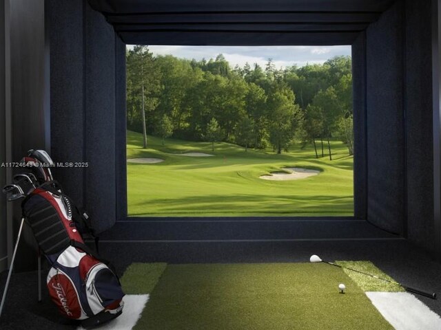 game room with golf simulator