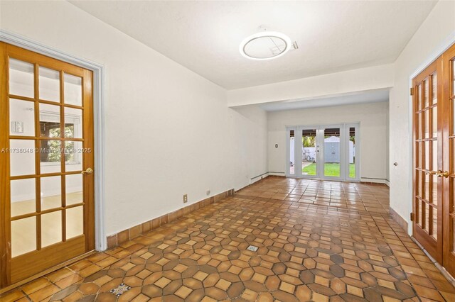 unfurnished bedroom featuring ornamental molding, multiple closets, and light wood-type flooring