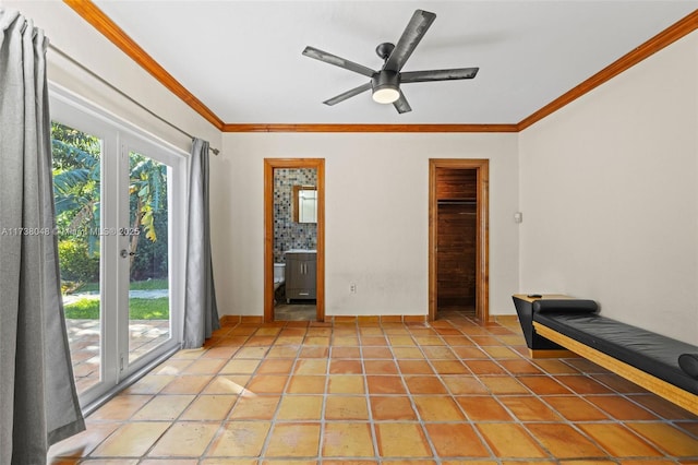 interior space with crown molding, plenty of natural light, light tile patterned floors, and ceiling fan