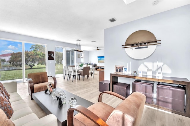 living room with light hardwood / wood-style flooring