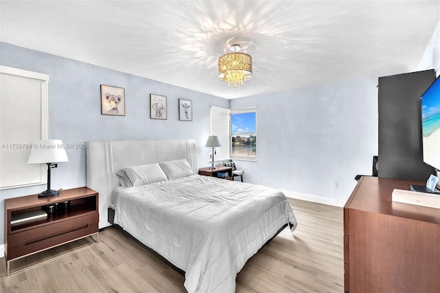 bedroom with light wood-type flooring