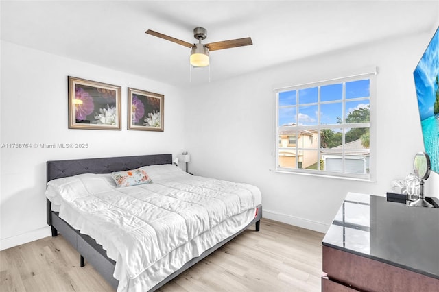 bedroom featuring ceiling fan and light hardwood / wood-style flooring