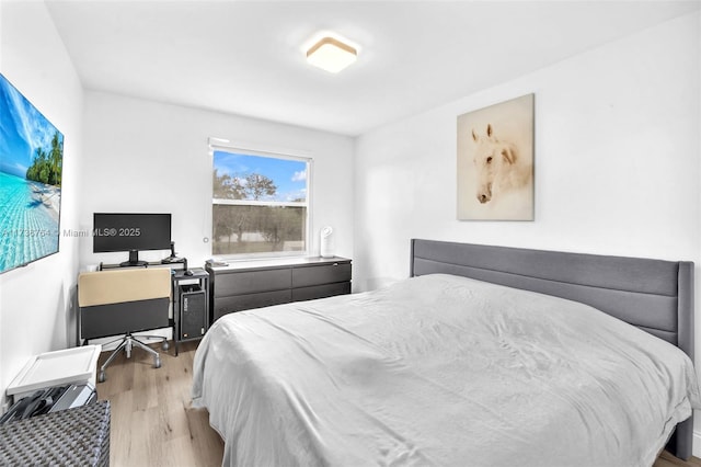 bedroom with light hardwood / wood-style floors