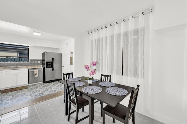 tiled dining space with sink