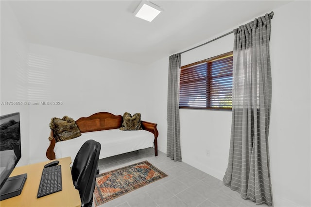 bedroom featuring light tile patterned flooring