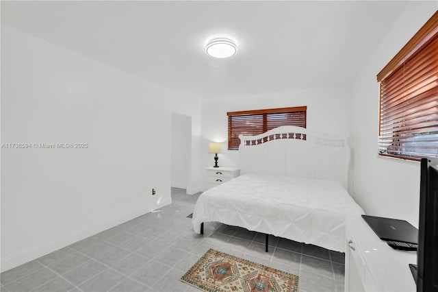 bedroom featuring tile patterned flooring