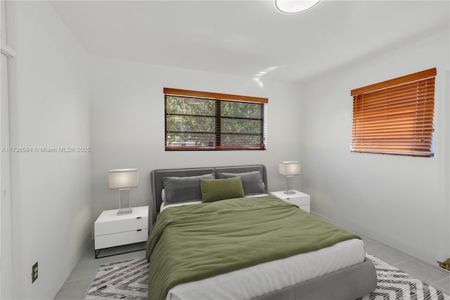 bedroom with light tile patterned flooring