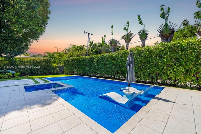 339 NE 100th St, Miami Shores, FL 33138 - view of swimming pool featuring an in-ground hot tub, a fenced backyard, and a patio
