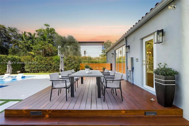 339 NE 100th St, Miami Shores, FL 33138 - deck at dusk with outdoor dining space