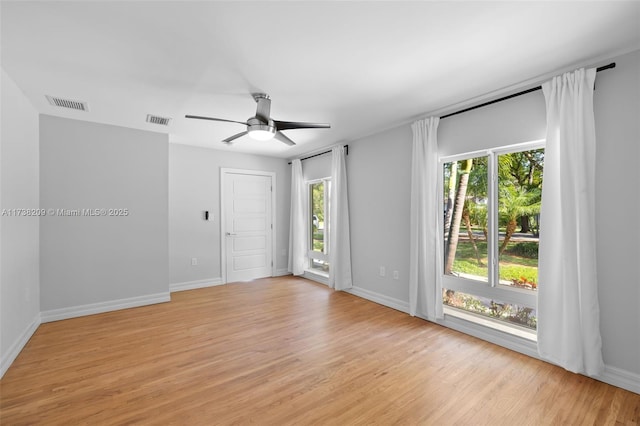 339 NE 100th St, Miami Shores, FL 33138 - empty room featuring light wood-style floors, ceiling fan, and baseboards