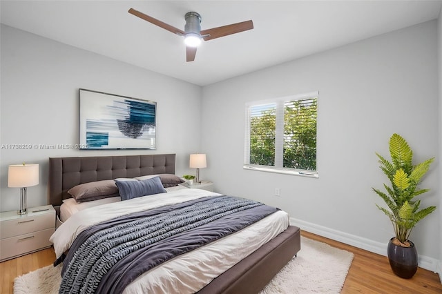 339 NE 100th St, Miami Shores, FL 33138 - bedroom featuring wood finished floors, baseboards, and a ceiling fan