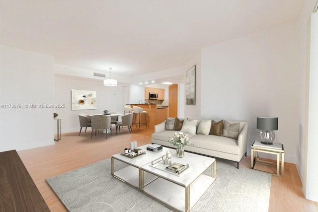 living room with light hardwood / wood-style flooring