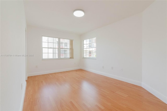 spare room with light hardwood / wood-style floors