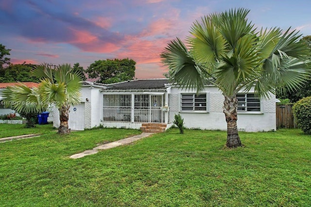 view of front of home featuring a yard