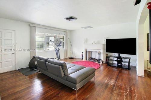 living room with dark hardwood / wood-style floors