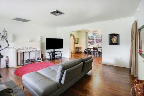 dining area featuring dark hardwood / wood-style flooring and a chandelier