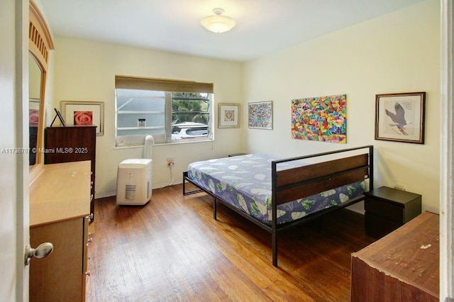 bedroom featuring wood-type flooring