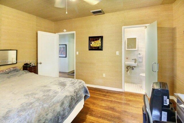 bathroom with shower / tub combo with curtain, tile patterned flooring, and tile walls