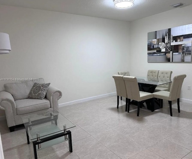 10519 W 33rd Ct Unit 10519, Hialeah, FL 33018 - dining space featuring baseboards and light tile patterned flooring