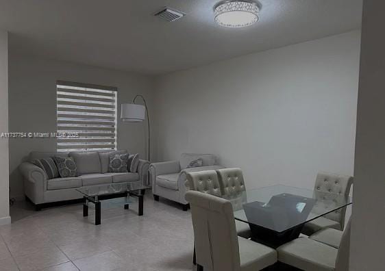 10519 W 33rd Ct Unit 10519, Hialeah, FL 33018 - dining room featuring light tile patterned floors and baseboards