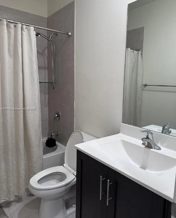 10519 W 33rd Ct Unit 10519, Hialeah, FL 33018 - bathroom featuring toilet, shower / bath combination with curtain, and vanity