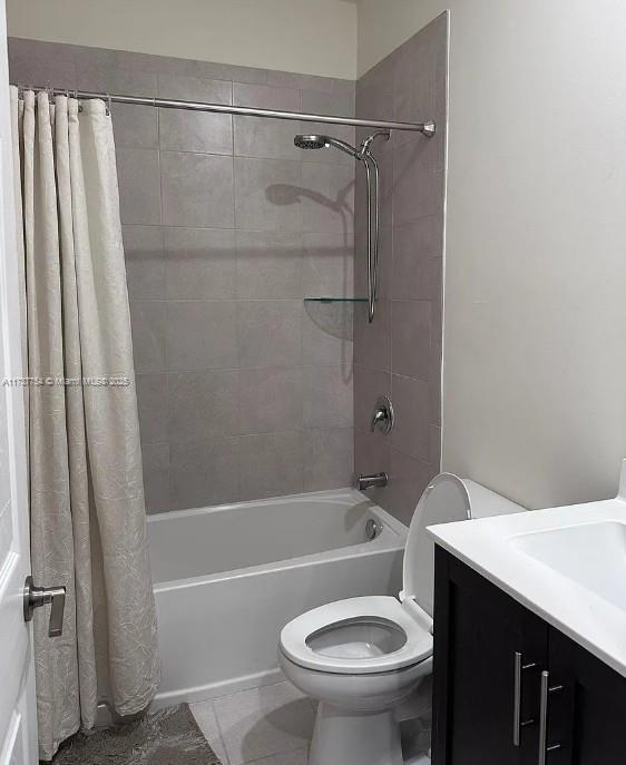 10519 W 33rd Ct Unit 10519, Hialeah, FL 33018 - full bath with shower / tub combo, toilet, tile patterned floors, and vanity