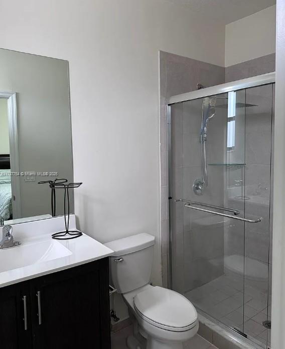 10519 W 33rd Ct Unit 10519, Hialeah, FL 33018 - full bath featuring a shower stall, vanity, and toilet