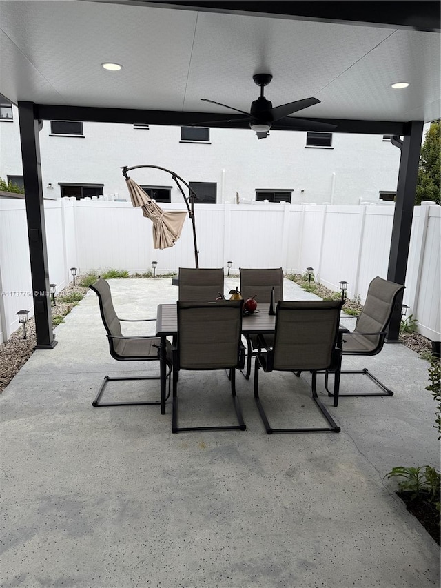 10519 W 33rd Ct Unit 10519, Hialeah, FL 33018 - view of patio / terrace with outdoor dining area, ceiling fan, and a fenced backyard