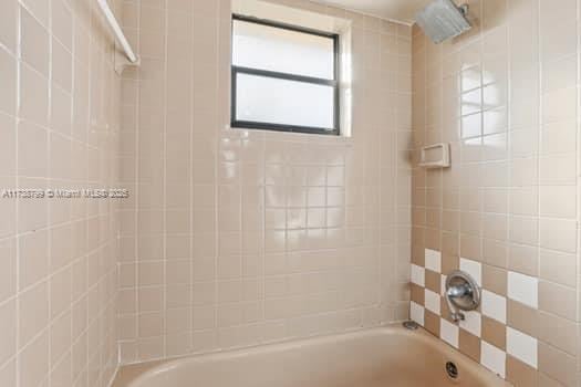 full bath featuring washtub / shower combination