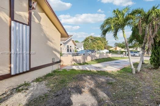 view of yard featuring a residential view and fence