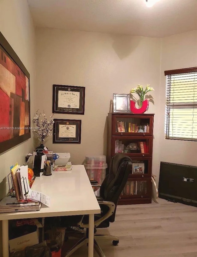 home office with light wood-type flooring