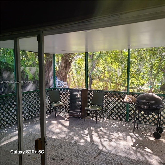 sunroom / solarium with plenty of natural light