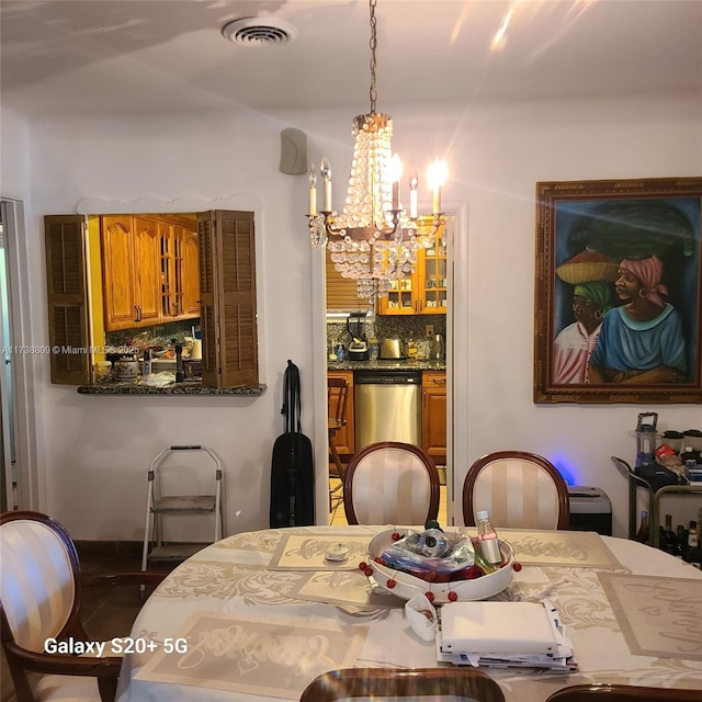 dining space featuring a chandelier