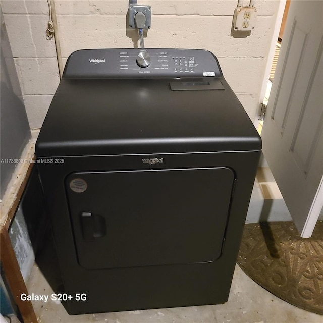 details featuring washer / clothes dryer and concrete flooring