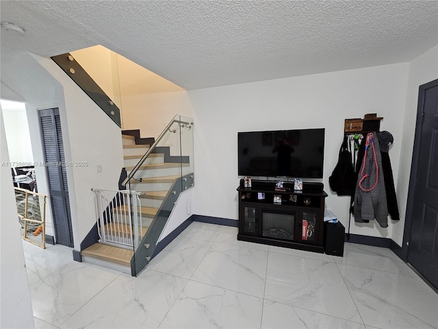 stairs with a textured ceiling