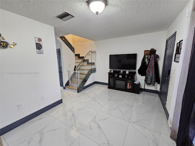 living room with a textured ceiling