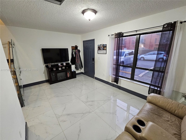 living room with a textured ceiling