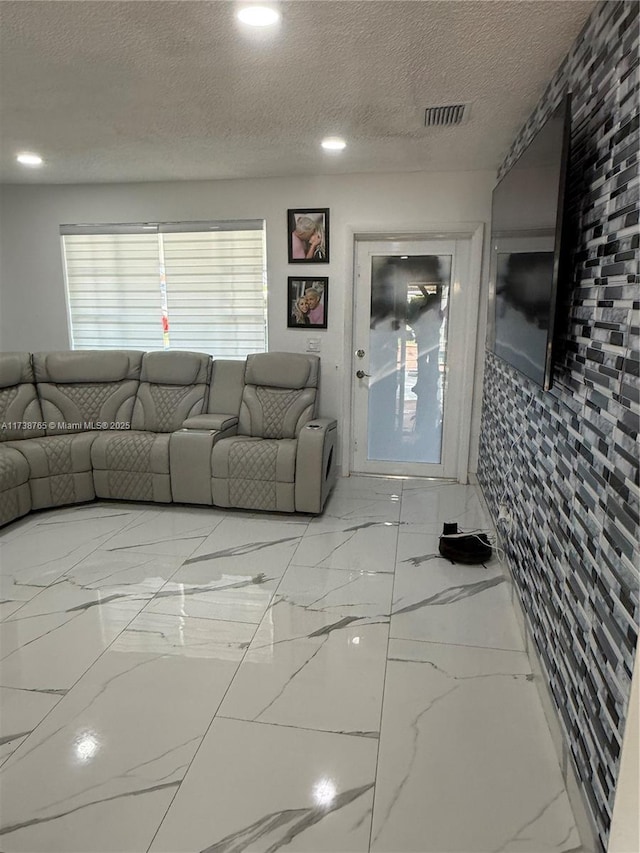 living room with a textured ceiling