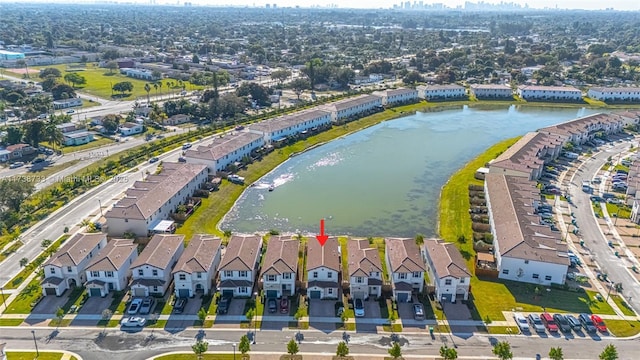 drone / aerial view with a water view