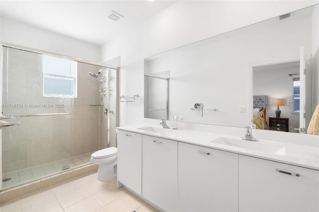 bathroom with vanity, an enclosed shower, tile patterned floors, and toilet