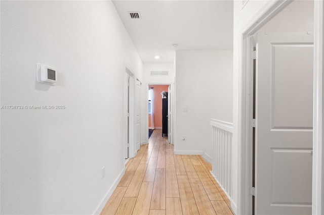 hall with light wood-type flooring