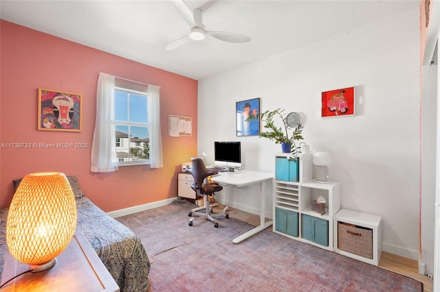 home office featuring ceiling fan and carpet flooring