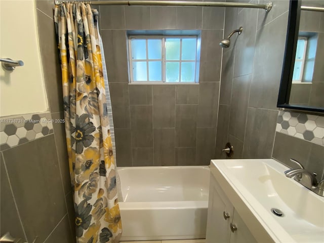 bathroom featuring shower / bath combination with curtain and vanity