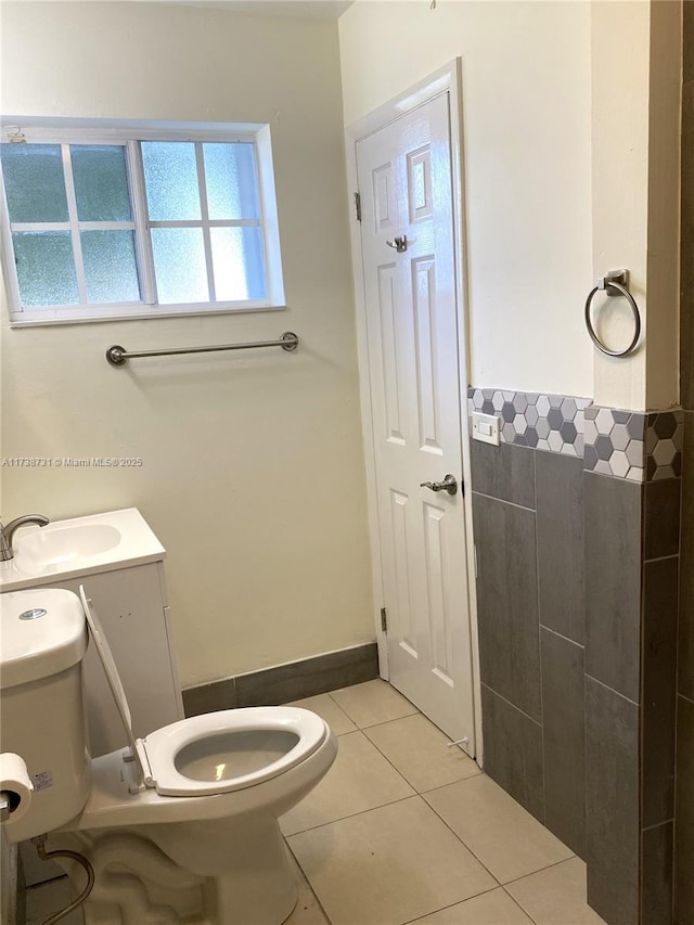 bathroom with vanity, tile patterned floors, and toilet