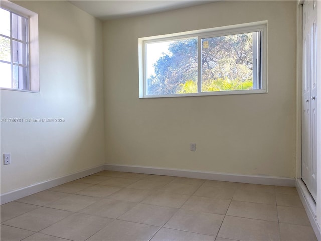 empty room featuring light tile patterned floors