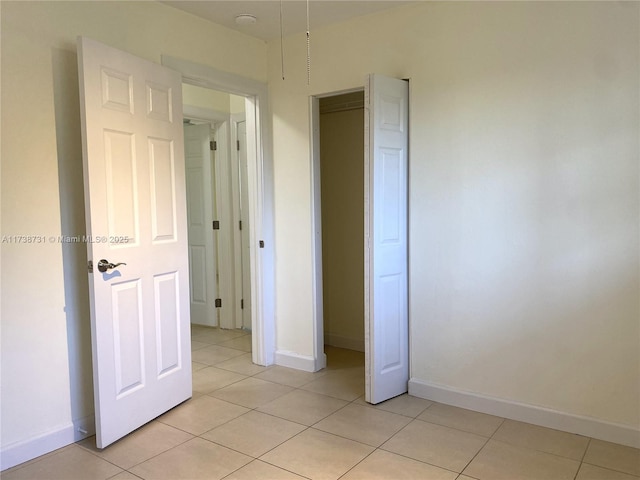 unfurnished bedroom featuring light tile patterned floors