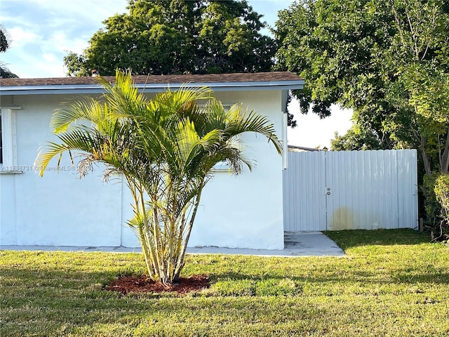 view of home's exterior featuring a yard