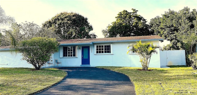 ranch-style house with a front yard